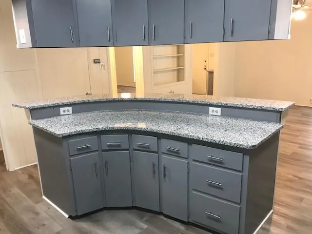 a kitchen with granite countertop a sink and a granite counter tops