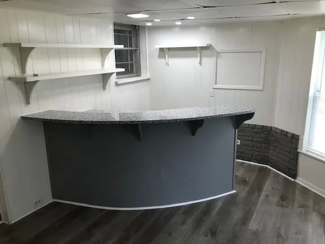 an empty room with a empty space and windows