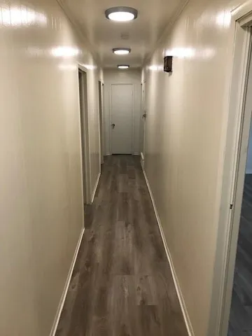 a bathroom with a granite countertop sink and toilet
