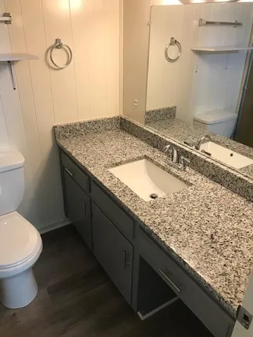 an empty room with wooden floor