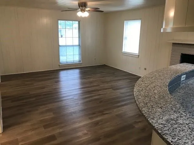 a view of a livingroom with wooden floor