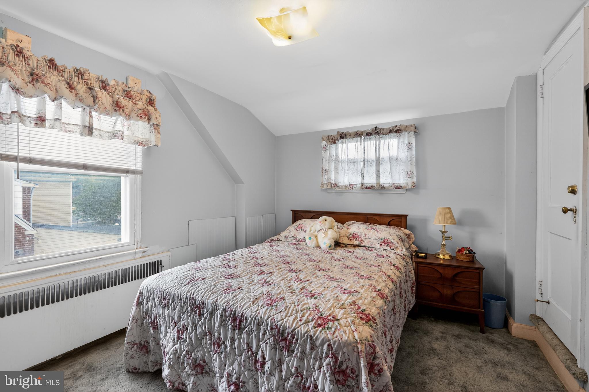 1424 Burmont Road Havertown, PA 19083 - Photo 30 of 37 a bedroom with a bed and a window