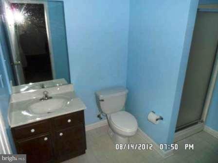 3610 Jackson Cabin Road Phoenix, MD 21131 - Photo 8 of 29 a bathroom with a granite countertop toilet and a sink