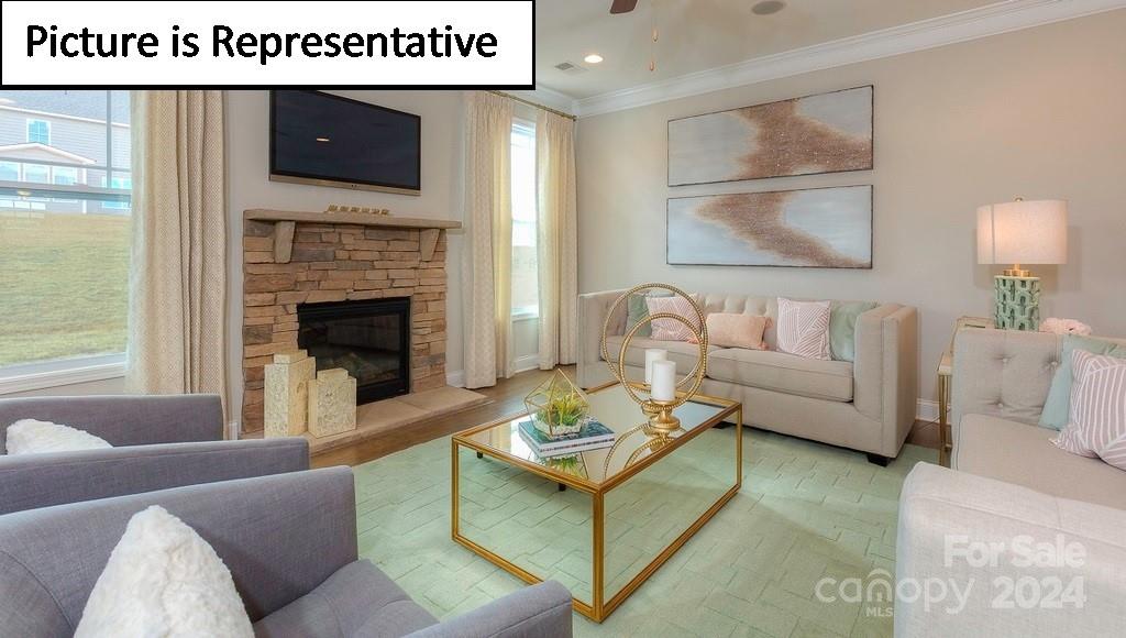 110 Saidin Lane Troutman, NC 28166 - Photo 19 of 48 a living room with furniture and a fireplace