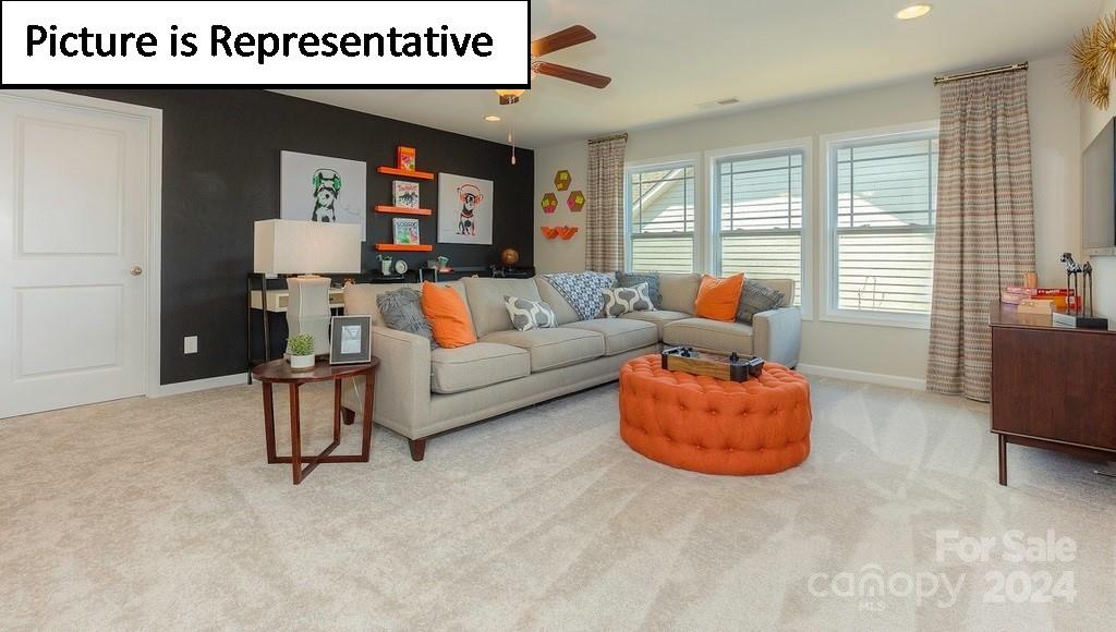 110 Saidin Lane Troutman, NC 28166 - Photo 23 of 48 a living room with furniture and a large window