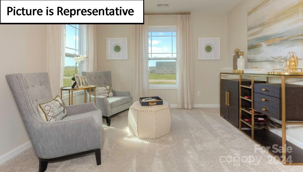 110 Saidin Lane Troutman, NC 28166 - Photo 28 of 48 a living room with furniture and a window