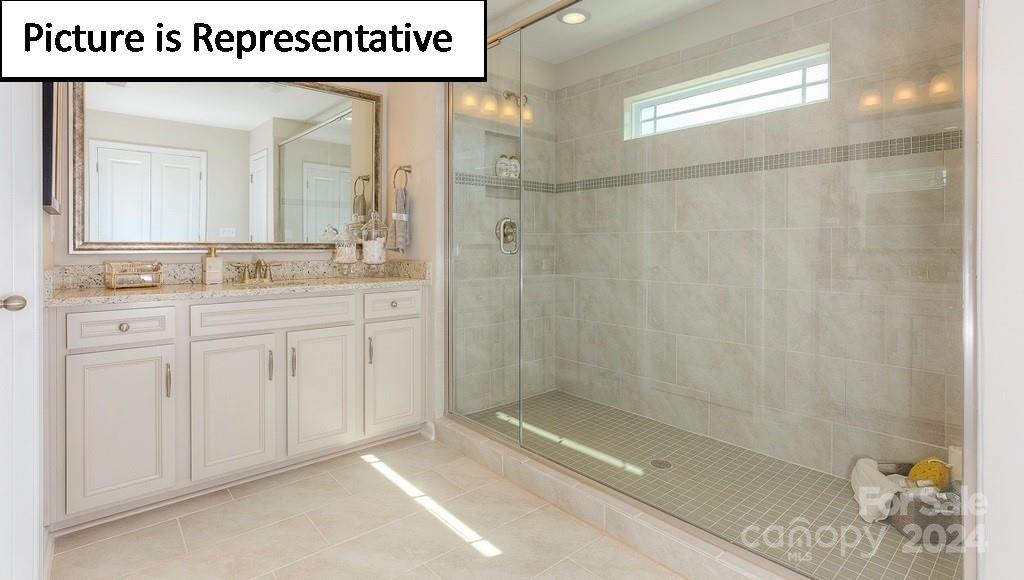 110 Saidin Lane Troutman, NC 28166 - Photo 29 of 48 a bathroom with a shower a sink and a mirror