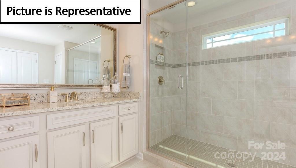 110 Saidin Lane Troutman, NC 28166 - Photo 30 of 48 a bathroom with a shower a sink and a mirror