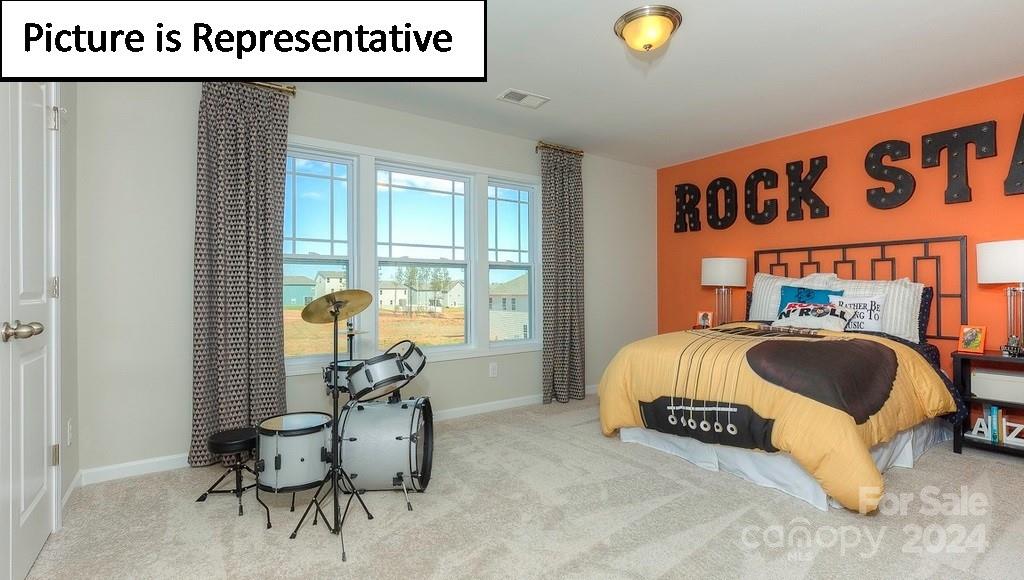 110 Saidin Lane Troutman, NC 28166 - Photo 38 of 48 a spacious bedroom with a bed and window