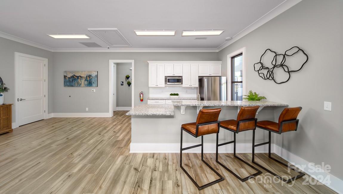 110 Saidin Lane Troutman, NC 28166 - Photo 43 of 48 a living room with furniture and wooden floor