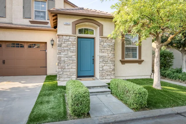 front view of a house with a yard