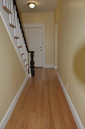 a view of entryway with wooden floor