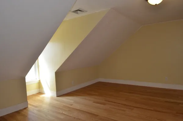 a view of a big room with wooden floor