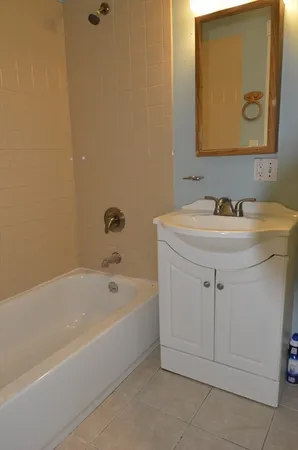 a bathroom with a sink and a bathtub