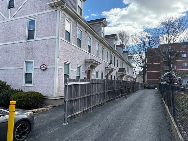 a view of a car park in front of house