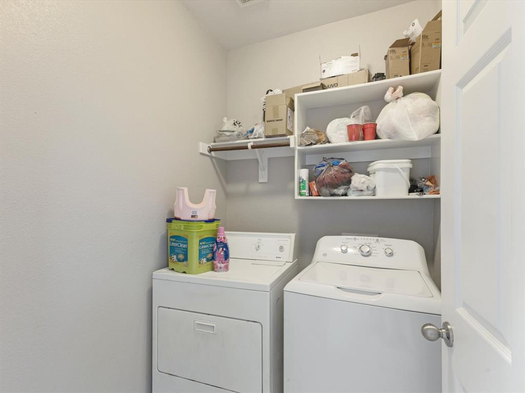 2009 Cooper Ridge Lane Heartland, TX 75126 - Photo 17 of 40 Washroom featuring washing machine and dryer