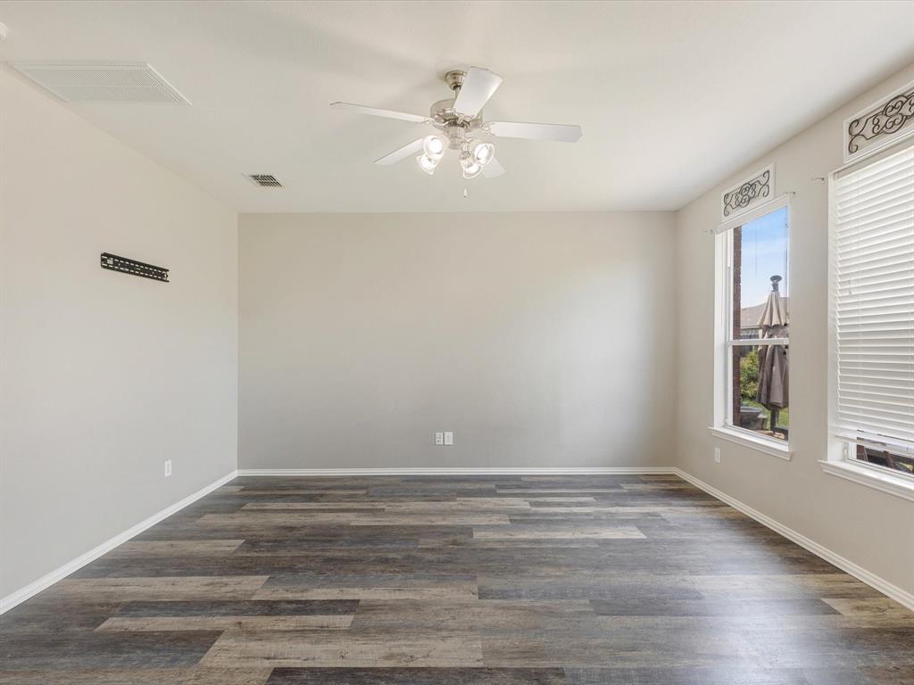 2009 Cooper Ridge Lane Heartland, TX 75126 - Photo 19 of 40 Unfurnished room with dark wood-style floors and ceiling fan
