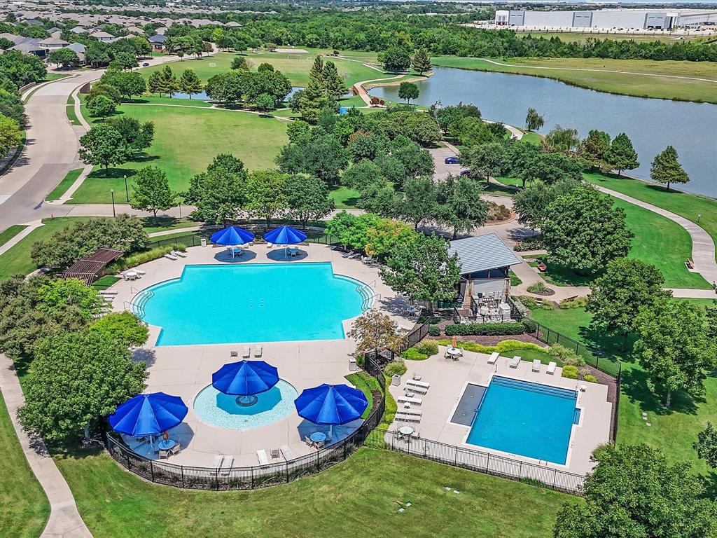2009 Cooper Ridge Lane Heartland, TX 75126 - Photo 35 of 40 Drone / aerial view of a pool and a nearby body of water