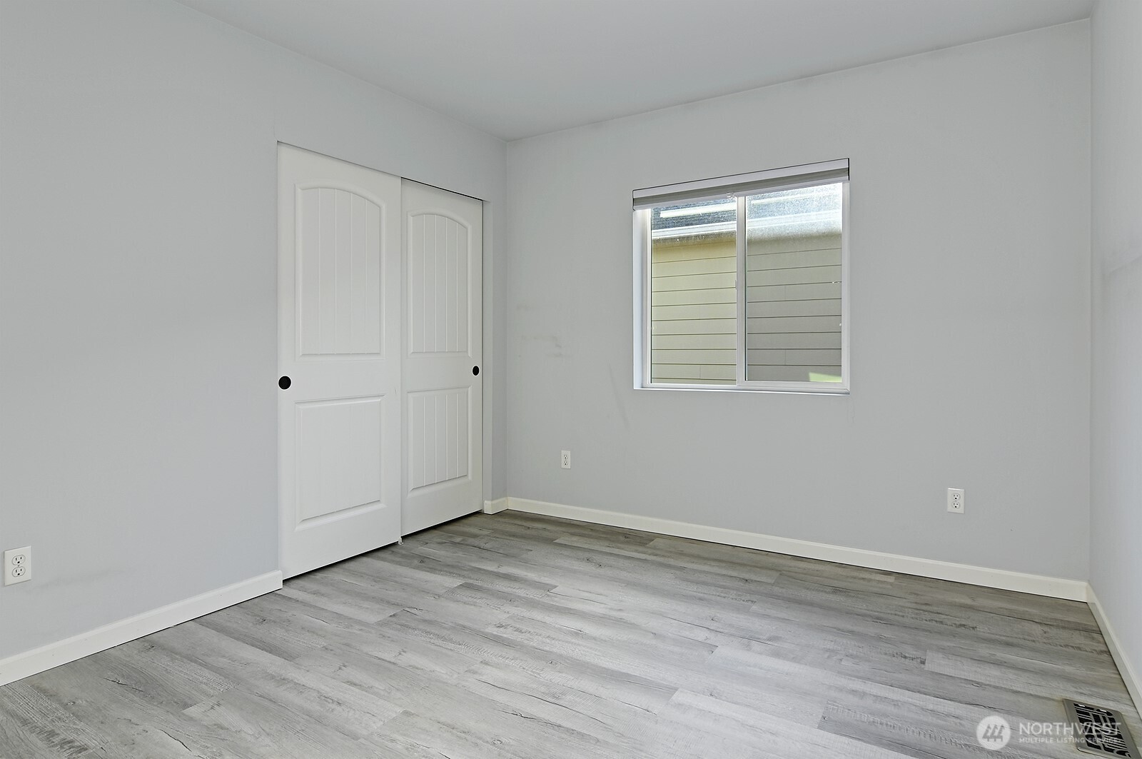 364 Field Place Northeast Renton, WA 98059 - Photo 19 of 28 a view of an empty room with wooden floor and a window