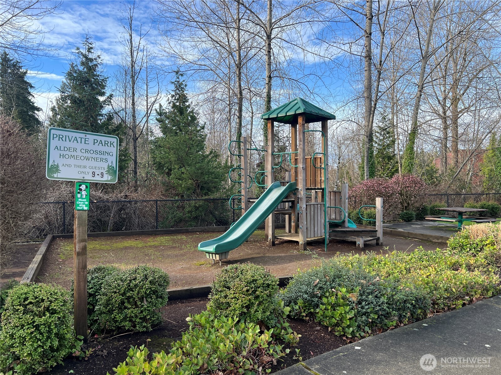 364 Field Place Northeast Renton, WA 98059 - Photo 28 of 28 a house with lots of trees and flowers in front of it