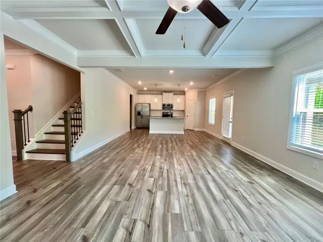 a view of an entryway with wooden floor