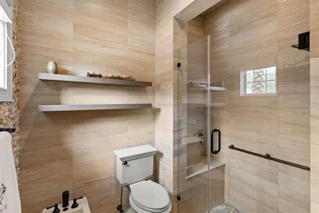 a bathroom with a toilet and a sink
