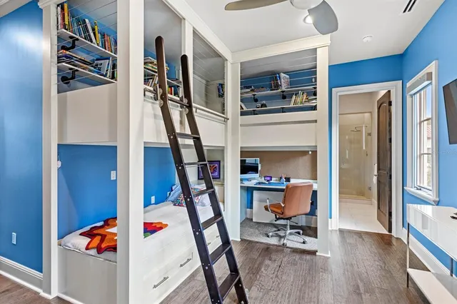 a view of a hallway with wooden floor and entryway
