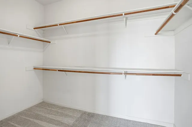 a view of an empty room with a bathroom