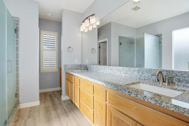 a bathroom with a sink and shower
