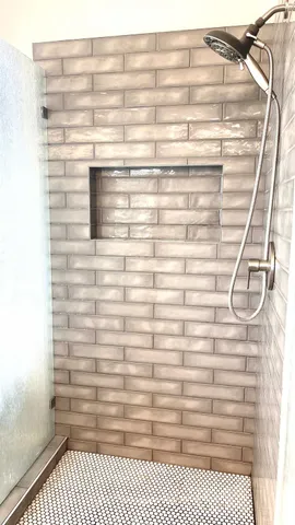 a bathroom with a toilet and a window