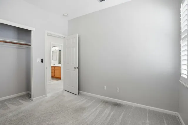 a bathroom with a sink a large mirror and shower
