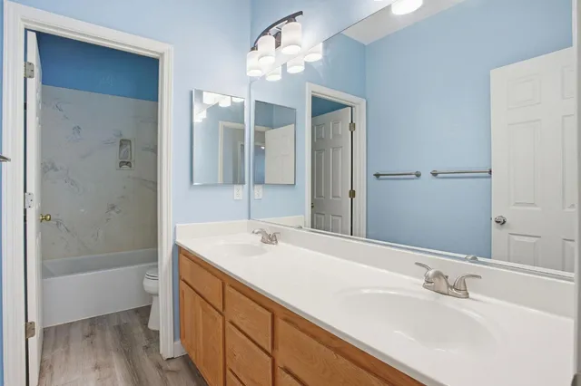 a bathroom with a bathtub and a toilet