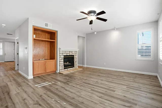 a bathroom with a sink mirror vanity and toilet