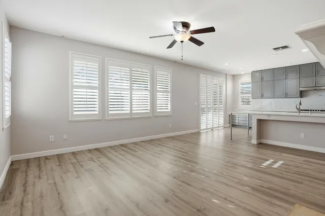 a kitchen with kitchen island a sink appliances and cabinets