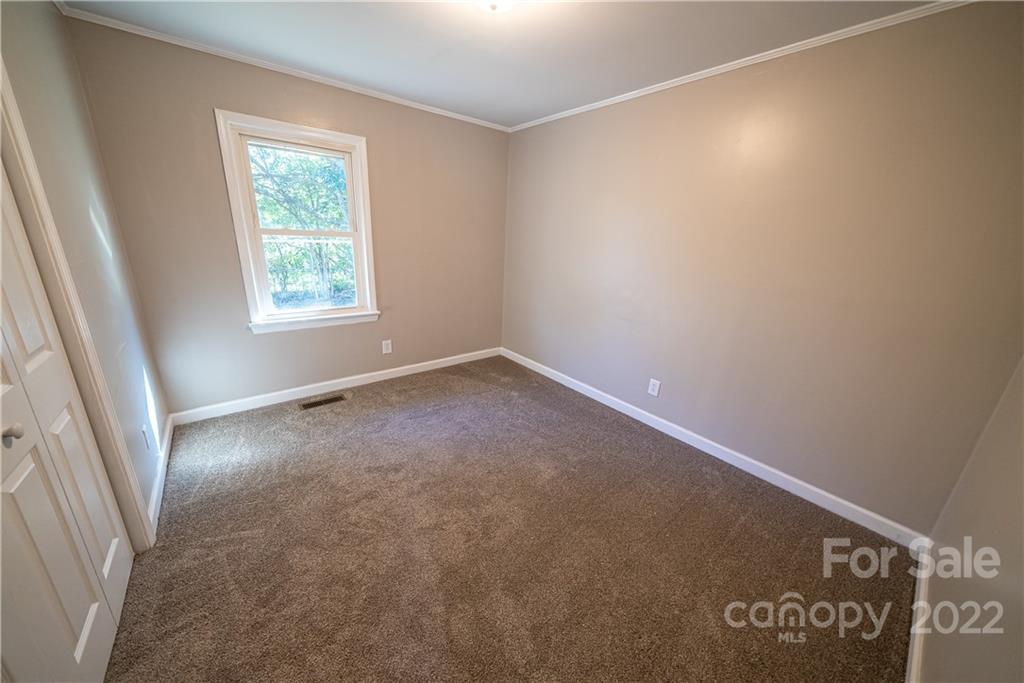 250 Rock Church Road Oakboro, NC 28129 - Photo 16 of 21 an empty room with windows