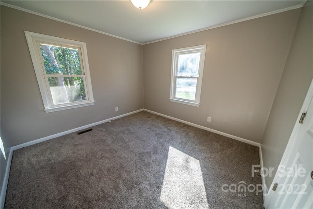 250 Rock Church Road Oakboro, NC 28129 - Photo 18 of 21 a view of an empty room with a window