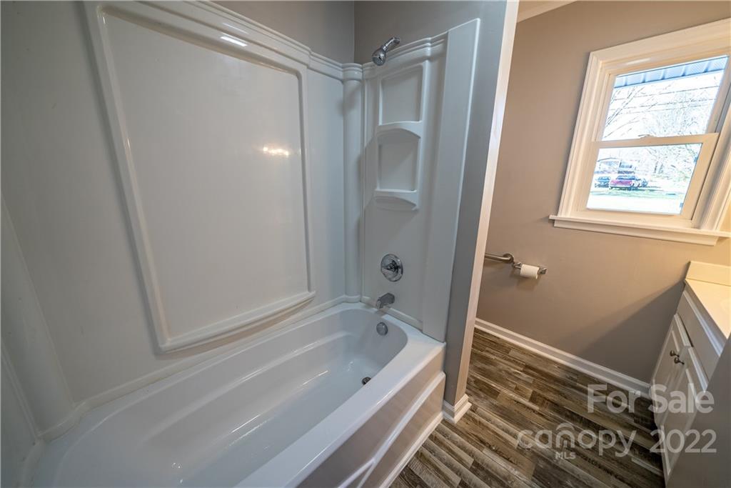 250 Rock Church Road Oakboro, NC 28129 - Photo 19 of 21 a bathroom with a bathtub and a shower