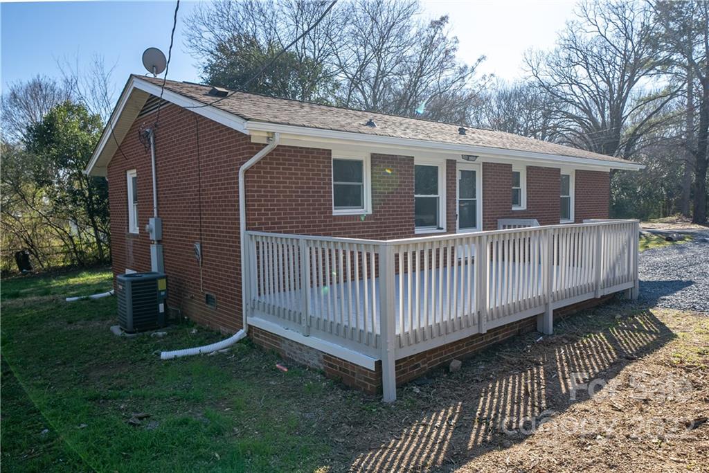 250 Rock Church Road Oakboro, NC 28129 - Photo 2 of 21 a view of a house with a yard and deck