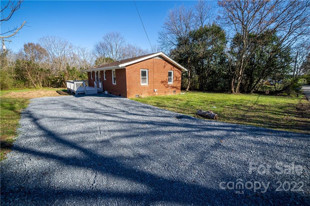 250 Rock Church Road Oakboro, NC 28129 - Photo 5 of 21 a house view with a backyard space