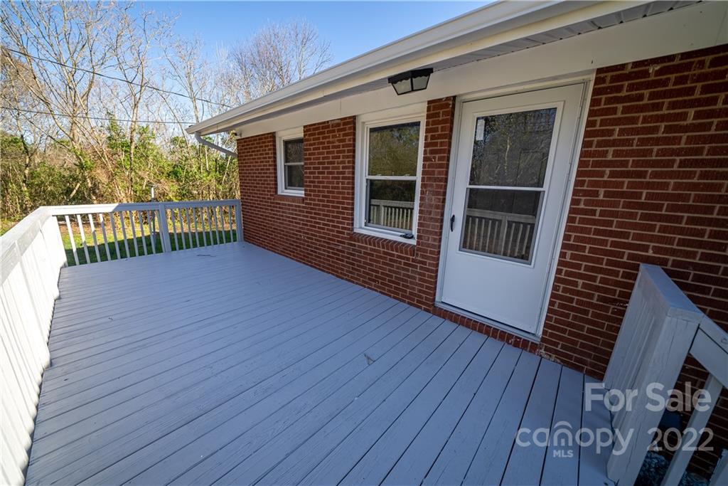 250 Rock Church Road Oakboro, NC 28129 - Photo 9 of 21 a view of deck with wooden floor and fence