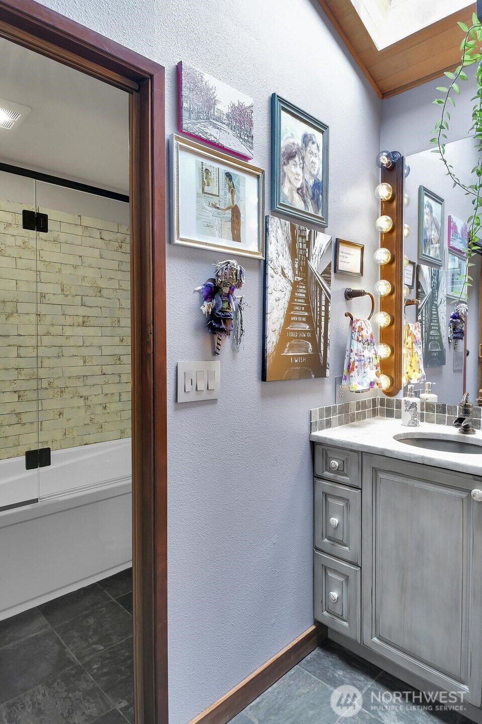 810 33rd Street Everett, WA 98201 - Photo 16 of 39 a bathroom with a sink and a mirror