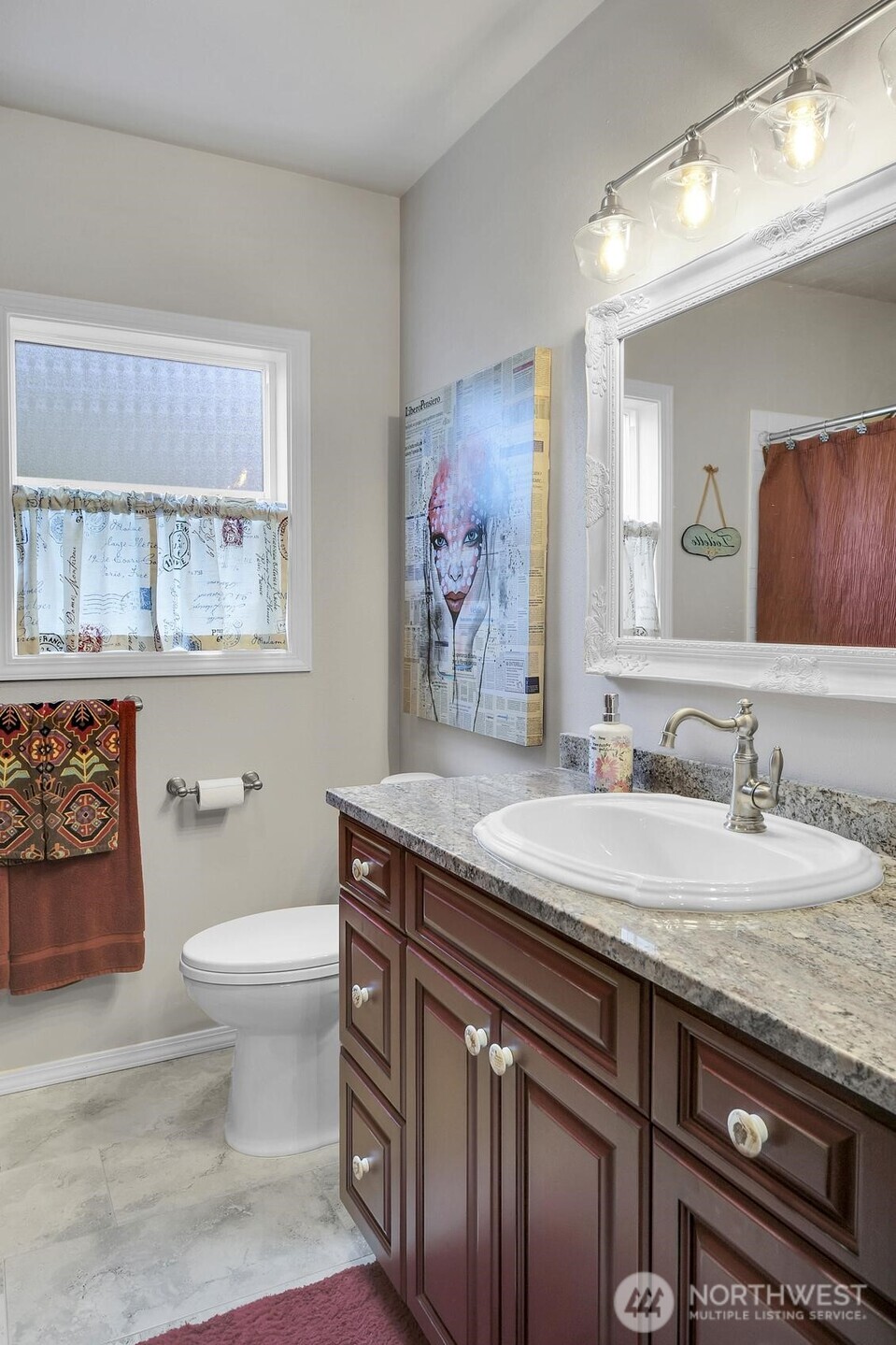 810 33rd Street Everett, WA 98201 - Photo 20 of 39 a bathroom with a granite countertop sink a toilet and a mirror