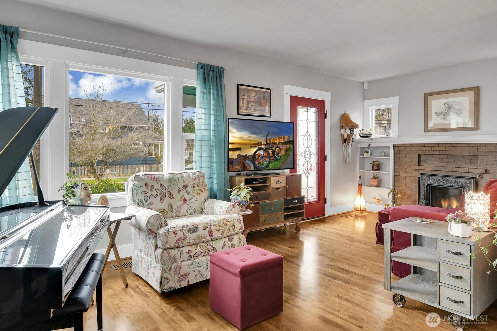 810 33rd Street Everett, WA 98201 - Photo 3 of 39 a living room with furniture large window and a fireplace