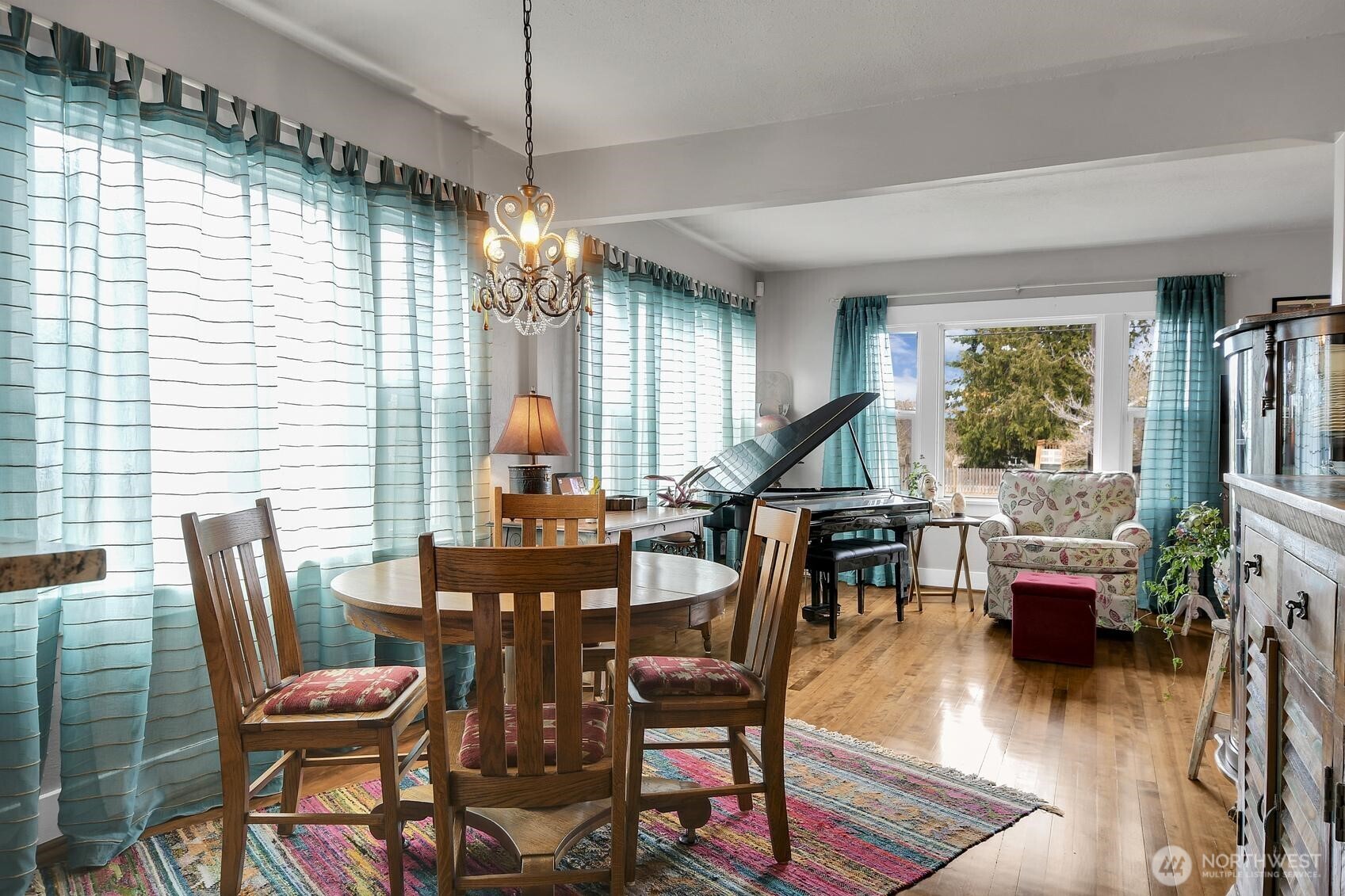 810 33rd Street Everett, WA 98201 - Photo 6 of 39 a view of a dining room with furniture window and wooden floor