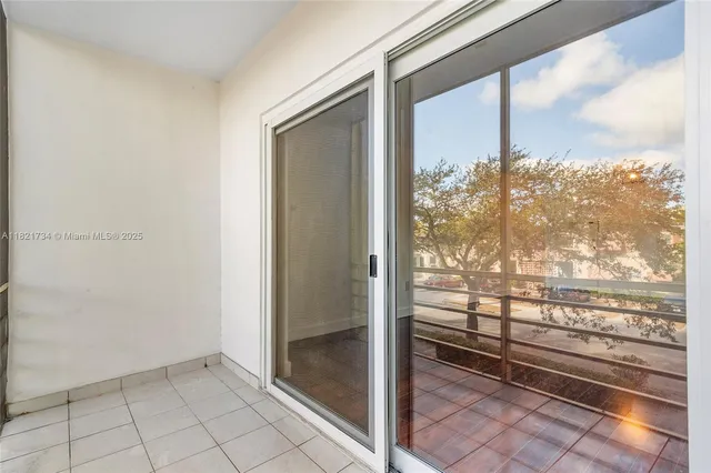 a view of a balcony with wooden floor