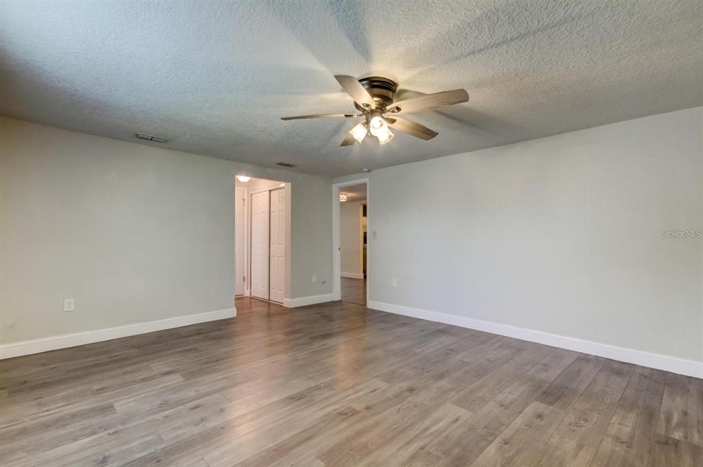 7144 Fairfax Drive Port Richey, FL 34668 - Photo 22 of 53 a view of an empty room with a window