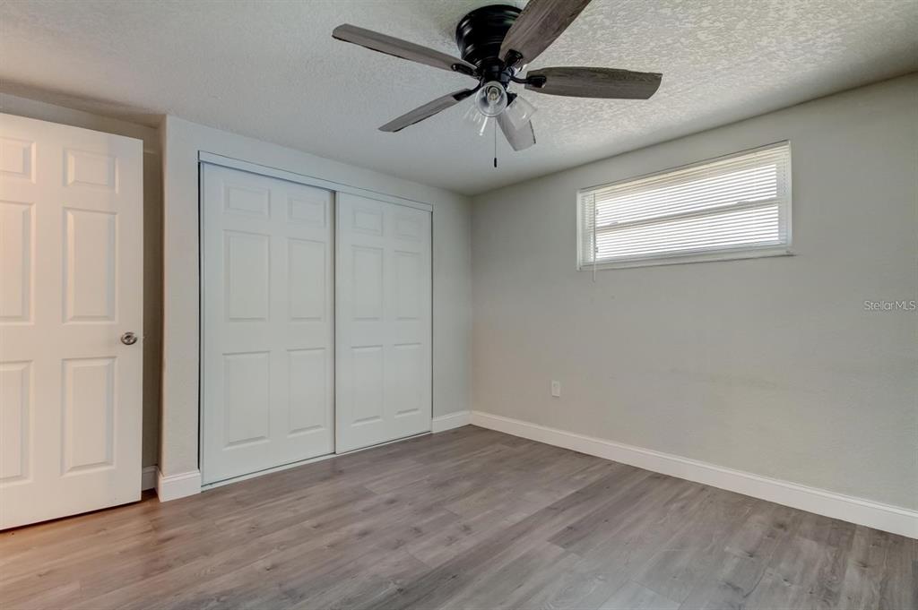 7144 Fairfax Drive Port Richey, FL 34668 - Photo 38 of 53 wooden floor in an empty room