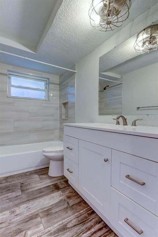 7144 Fairfax Drive Port Richey, FL 34668 - Photo 40 of 53 a bathroom with a sink a toilet and shower