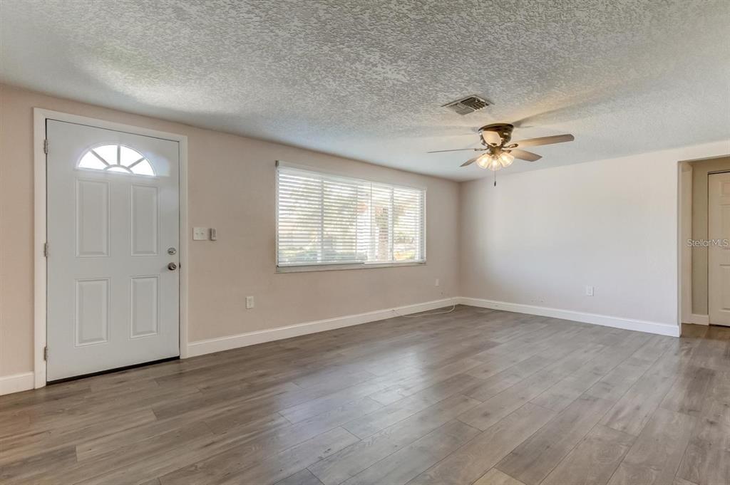 7144 Fairfax Drive Port Richey, FL 34668 - Photo 4 of 53 a view of an empty room with a window
