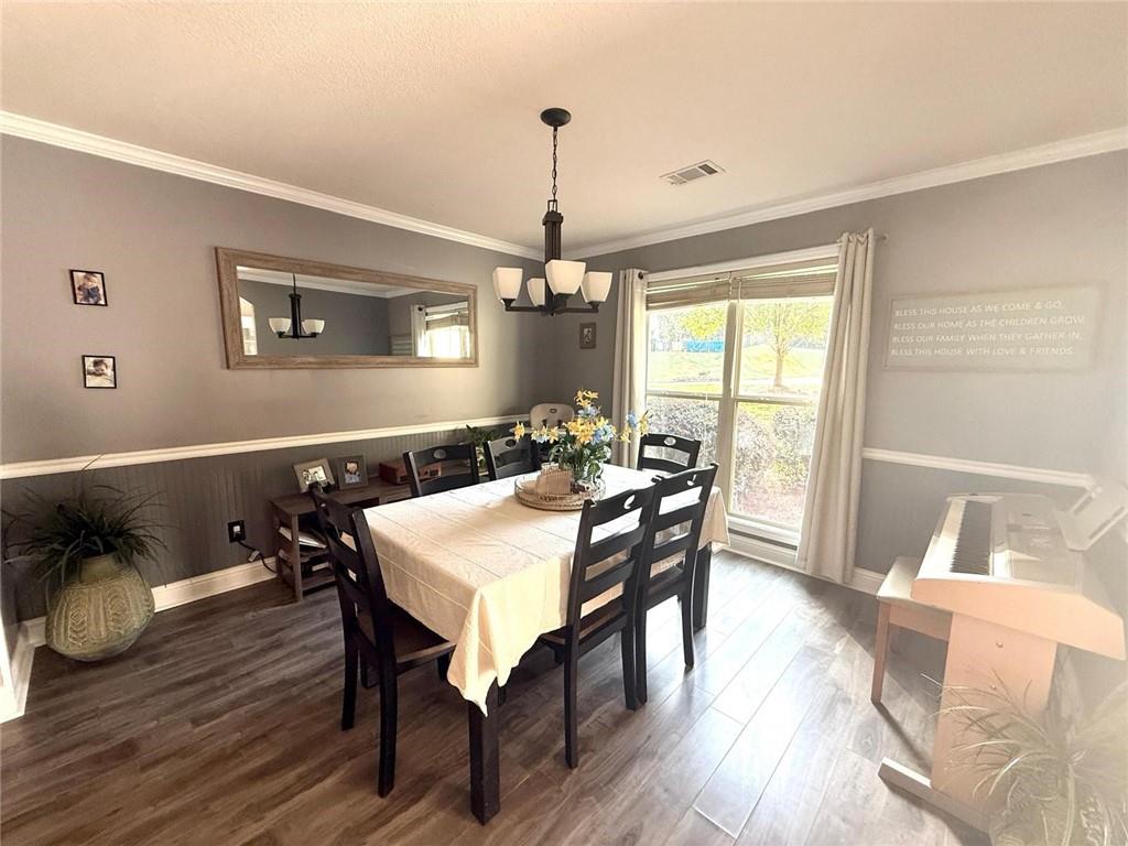 1071 Covenant Court Bethlehem, GA 30620 - Photo 14 of 20 a view of a dining room with furniture window and wooden floor